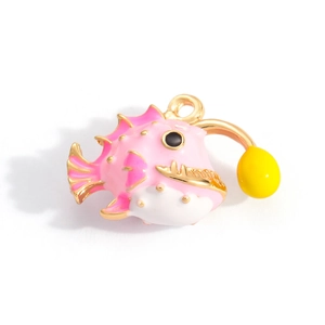 Detailed close-up of a pink and white enamel deep sea fish pendant with 18K gold plating