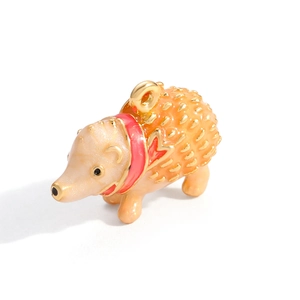 Detail of hedgehog pendant with colorful enamel inlay and gold-plated finish