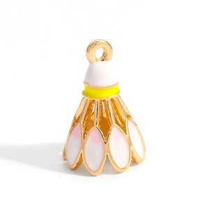 Detail of a golden badminton pendant with white enamel feathers and pink dots