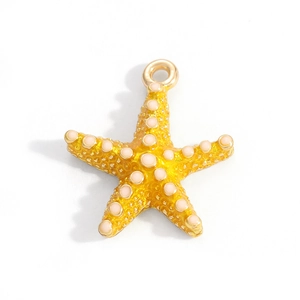 Detailed view of alloy starfish charm with yellow enamel finish and pink bead accents