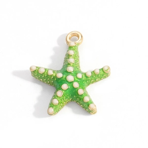 Detailed macro of green starfish charm with 18K gold plating and enamel oil finish
