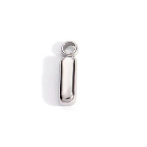 Close-up of a silver capsule pendant with mirror-polished finish and a sturdy ring bail