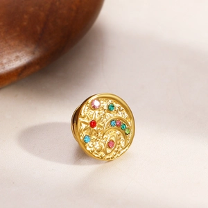 Macro shot of 18K gold plated celestial brooch with evil eye star and colorful crystals