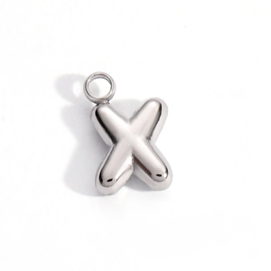 Polished silver stainless steel letter X pendant detail with a smooth mirror finish