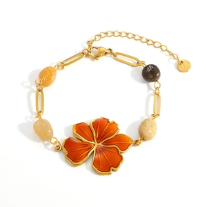 Golden stainless steel necklace with orange enamel flower and natural stone beads