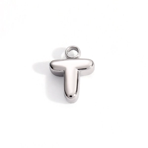 Close-up of a silver letter T pendant in polished stainless steel with smooth mirror finish