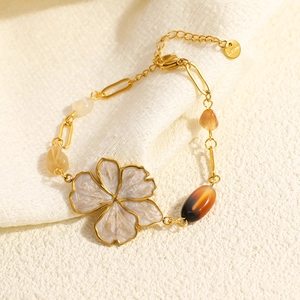Gold stainless steel flower necklace with natural stone petals and amber beads