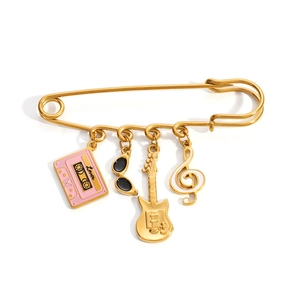 Golden music themed safety pin brooch with lover tape guitar and treble clef charms