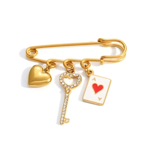Golden stainless steel safety pin brooch with heart, key, and Ace of Hearts pendants