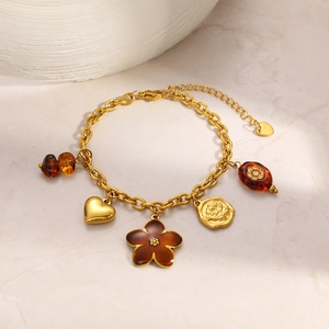 Gold stainless steel link bracelet with brown floral, heart, and rose relief charms