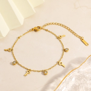 18K gold plated stainless steel bracelet with key charms and sparkling cubic zirconia