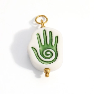 Ethnic white ceramic pendant with green healing hand pattern and gold metal accents