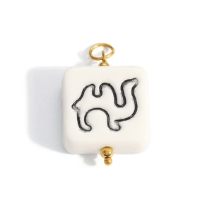 Square white ceramic pendant with black camel graphic and gold metal rings for DIY jewelry