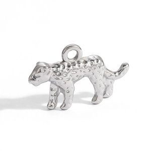 Macro detail of silver leopard charm with textured spot pattern and top ring attachment