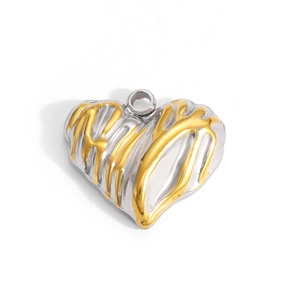 Macro detail of heart-shaped pendant with liquid lava gold finish on silver base