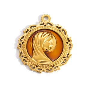 Detailed macro view of an 18k gold plated portrait pendant with vintage enamel and relief
