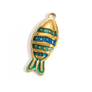 Detail of vintage gold plated fish pendant with blue green enamel and textured scales