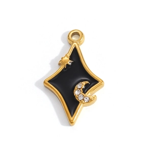 Macro detail of a gold-plated star and crescent moon pendant with black enamel inlay