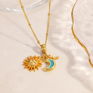 Stainless steel gold chain necklace featuring colorful sun, moon, and star pendants