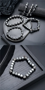 Détails de bracelets en hématite foncée avec perles cylindriques et formes géométriques facettées