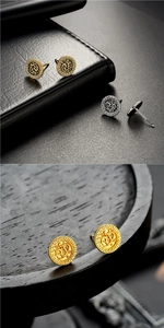 Detalle de pendientes retro plateados y dorados con relieve de dragón y greca griega