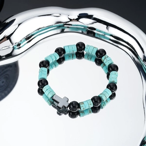 Hip hop beaded bracelet with black stones, turquoise accents and silver cross charm
