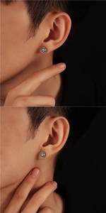 Détail de boucles d'oreilles soleil vintage pour hommes avec esthétique gothique