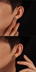 Detailed view of Eye of Horus stud earring in gold and black for a trendy look