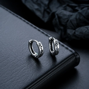 Silver hoop earrings for men and women featuring black engraved heartbeat patterns