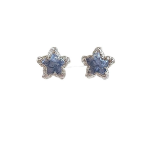 Elegant blue star-shaped stud earrings with sparkling crystals and silver metal texture