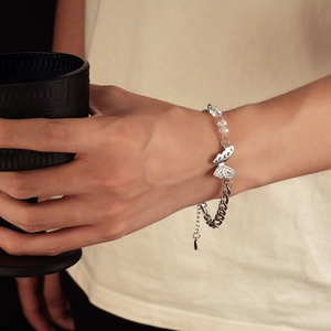 Detail of silver butterfly bracelet with mixed chains and sparkling crystal beads