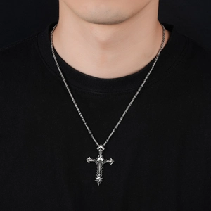 Retro punk skull cross pendant necklace in vintage silver finish on black shirt