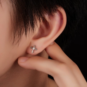Silver cross stud earring with zircon stone on ear, punk style jewelry for men and women