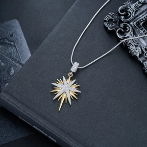 Detail of double-layer North Star pendant with gold plating and sparkling zircon stones