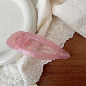 Detailed view of the 11.5cm pink translucent hollow leaf hair claw clip on lace