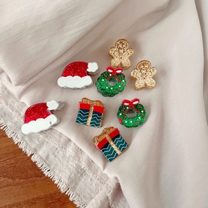 Mini acrylic Christmas hair clips featuring gingerbread man and Santa tree festive patterns