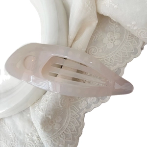 Elegant 11.5cm light pink hollow leaf hair claw clip for women on white lace background