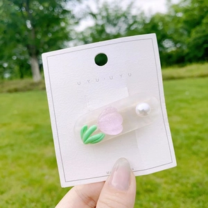 Sweet tulip hair clip with purple floral petal, pearl accent and green leaf detail