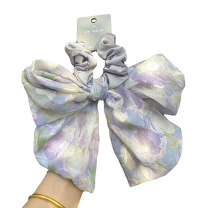 Floral print oversized bow hair scrunchie in purple and white tulle fabric