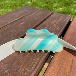 Iridescent cloud wavy acetate hair claw clip in blue and white marble pattern