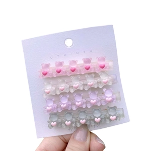 Cute Korean jelly bear hair clips set with pink hearts on a white display card