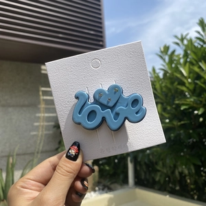 Y2K dopamine style blue LOVE hair clip with rhinestones and heart on display card