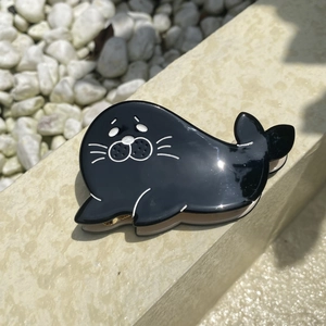 Cute seal shaped black acrylic hair claw clip for girls with a glossy acetate finish