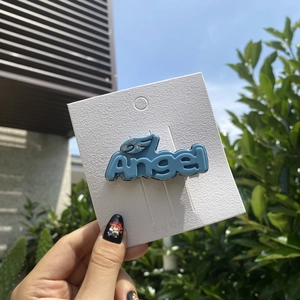 Blue Y2K acetate hair clip with Angel lettering design and sparkling rhinestone accents