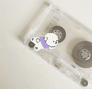 Detail of cute Bichon dog hair claw clip made of white acetate with purple scarf decor