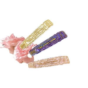Set of 3 creative acetate toothpaste hair clips in sparkling gold, purple, and pink