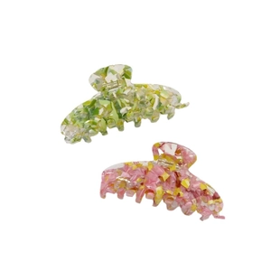 Floral acetic acid hair claw clips in pink and green colors with marble pattern