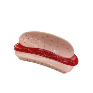 Creative hot dog shaped acetate hair claw clip with realistic bun and mustard design