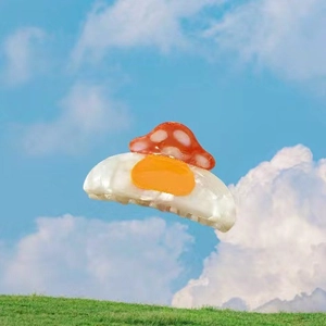 Close-up of cute acetic acid mushroom and fried egg hair claw clip for women