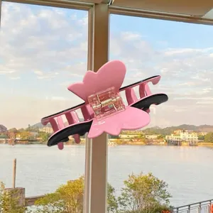 Pink and black butterfly hair claw clip with floral acetate finish for women